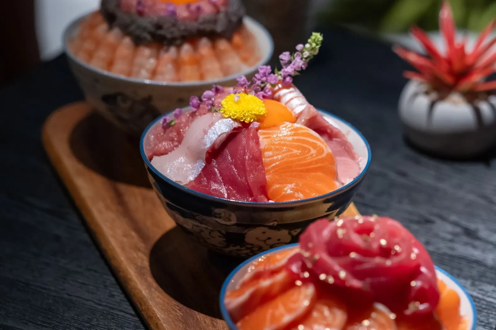 Chirashi bowls of tuna, salmon and uni
