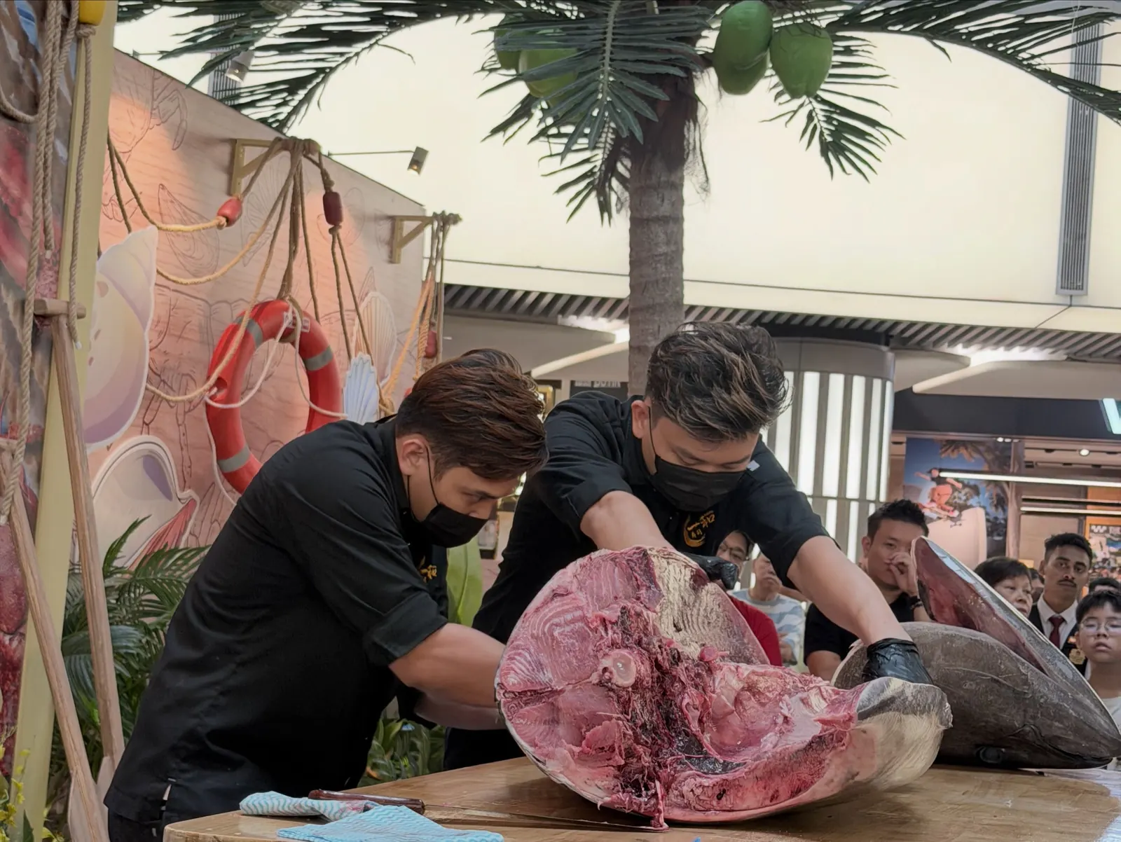 Sendo Ichi chefs breaking down a whole tuna at a live cutting show